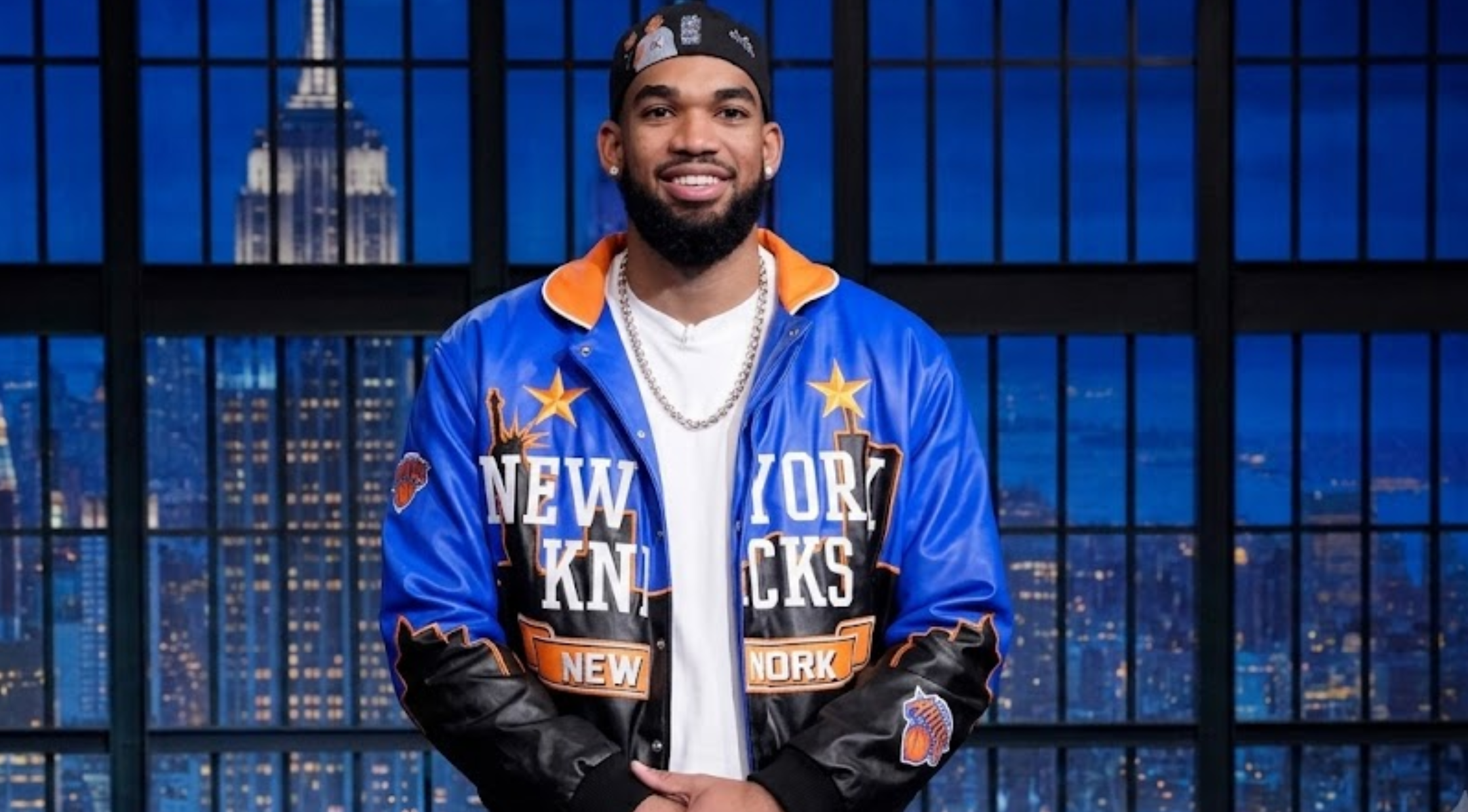 Karl-Anthony Towns The Tonight Show Starring Jimmy Fallon S13 blue and black New York Knicks leather varsity jacket with orange accents and graphic detailing