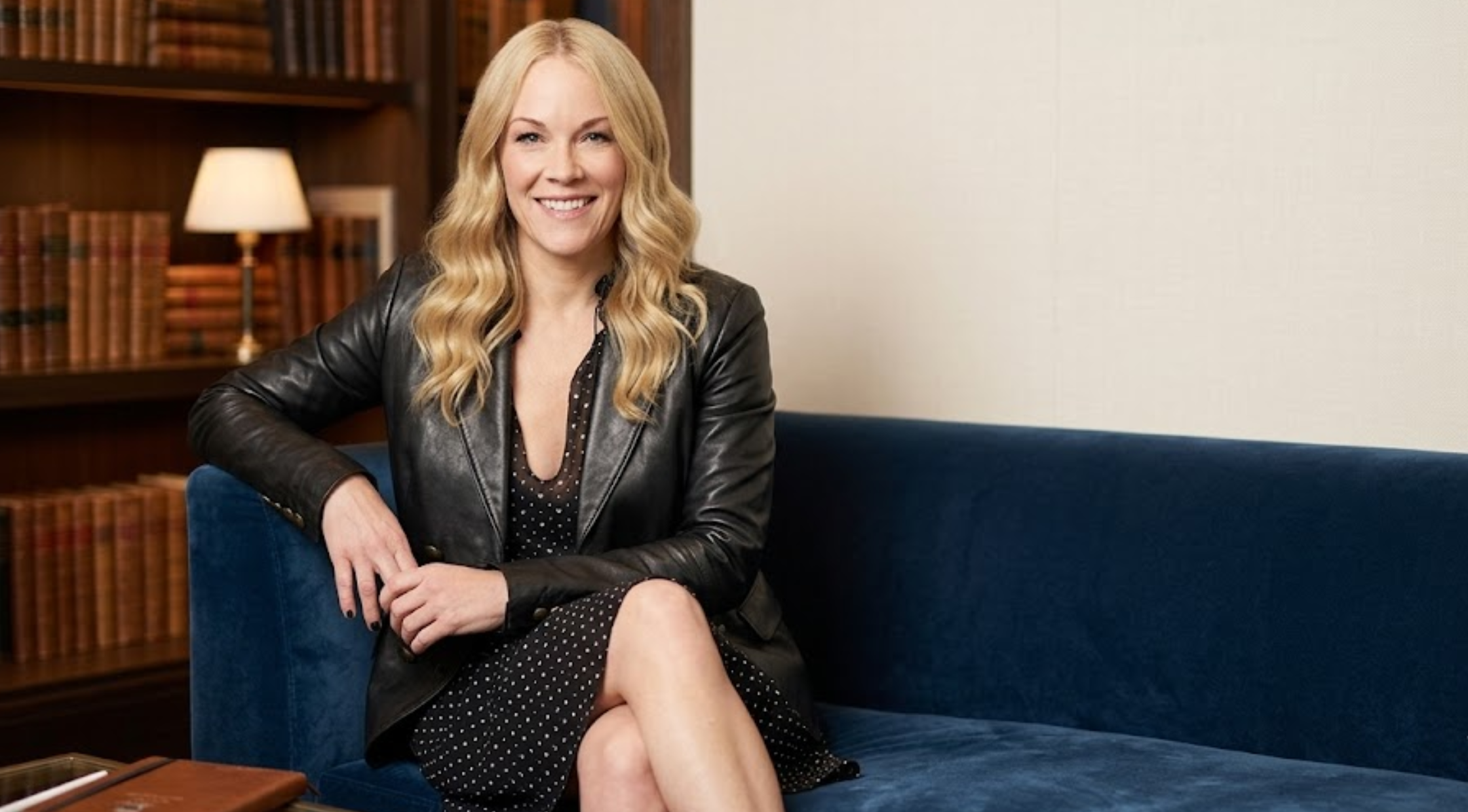 That 90s Show S01 Andrea Anders black double-breasted leather blazer jacket with antique brass button detailing and tailored silhouette